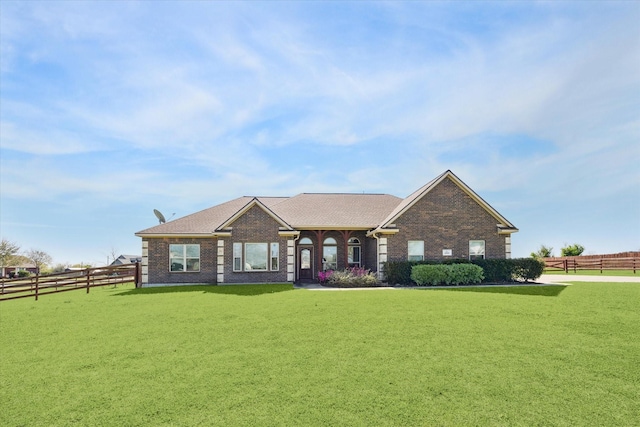 2688 Settlers Way Dr, Sealy, TX 77474 - view of front of property with brick siding, fence, and a front yard