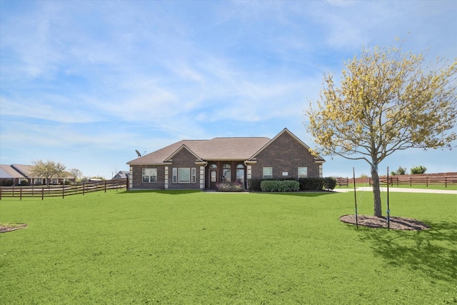 2688 Settlers Way Dr, Sealy, TX 77474 - view of front of property with brick siding, fence, and a front lawn