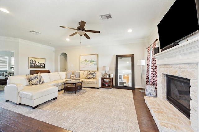 2688 Settlers Way Dr, Sealy, TX 77474 - living room featuring arched walkways, dark wood-style floors, visible vents, and ceiling fan