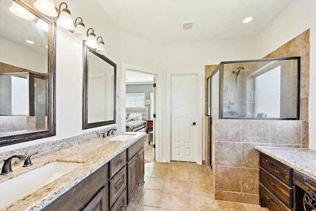 2688 Settlers Way Dr, Sealy, TX 77474 - full bath featuring visible vents, a sink, a stall shower, and double vanity