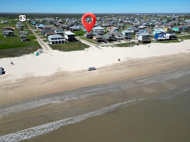 bird's eye view with a beach view and a residential view