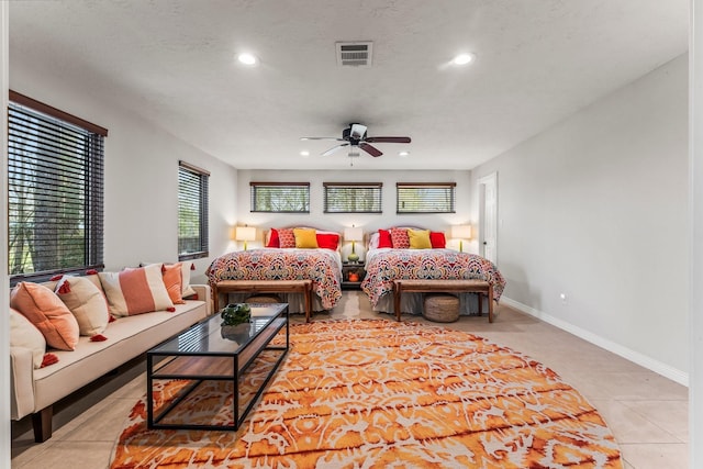 bedroom with baseboards, visible vents, tile patterned flooring, and recessed lighting