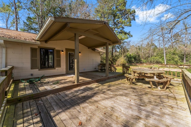 deck with outdoor dining area