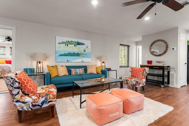 living area with recessed lighting, baseboards, visible vents, a ceiling fan, and wood finished floors