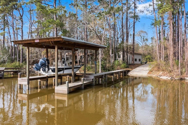 view of dock featuring a water view and boat lift