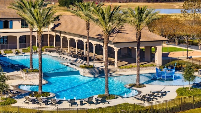 19415 Sorrel Stallion Trl, Tomball, TX 77377 - community pool featuring a patio area