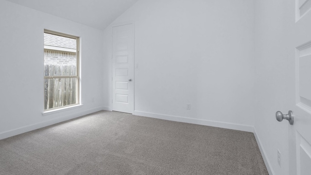 19415 Sorrel Stallion Trl, Tomball, TX 77377 - empty room featuring carpet flooring and vaulted ceiling