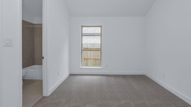 19415 Sorrel Stallion Trl, Tomball, TX 77377 - unfurnished bedroom featuring carpet floors and vaulted ceiling