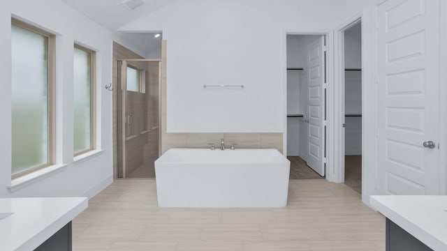19415 Sorrel Stallion Trl, Tomball, TX 77377 - full bathroom featuring vanity, a shower stall, a freestanding bath, and a spacious closet