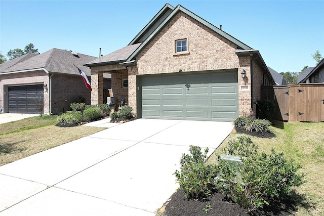 21586 Jordan Pond Rdg, Porter, TX 77365 - view of front of home featuring brick siding, a garage, and concrete driveway