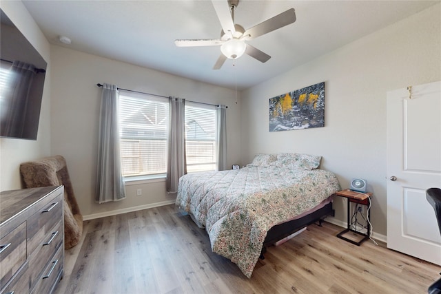 21586 Jordan Pond Rdg, Porter, TX 77365 - bedroom featuring light wood finished floors, baseboards, and ceiling fan