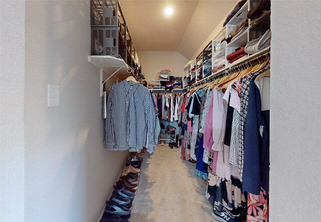 21586 Jordan Pond Rdg, Porter, TX 77365 - spacious closet featuring carpet and vaulted ceiling