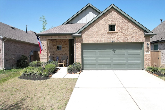 21586 Jordan Pond Rdg, Porter, TX 77365 - view of front facade featuring brick siding, board and batten siding, concrete driveway, an attached garage, and a front yard
