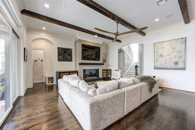 3702 Blue Bonnet, Houston, TX 77025 - living area featuring arched walkways, ceiling fan, a fireplace, beamed ceiling, and crown molding