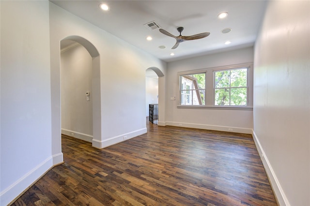 3702 Blue Bonnet, Houston, TX 77025 - empty room with a ceiling fan, arched walkways, dark wood-type flooring, recessed lighting, and baseboards