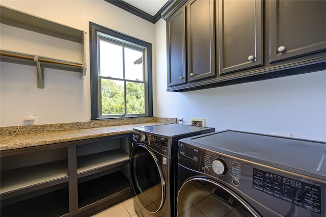 3702 Blue Bonnet, Houston, TX 77025 - clothes washing area featuring washer and dryer, cabinet space, crown molding, and light tile patterned floors