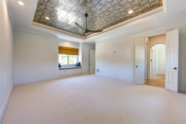 3702 Blue Bonnet, Houston, TX 77025 - carpeted empty room with a tray ceiling, ornamental molding, ceiling fan, arched walkways, and baseboards