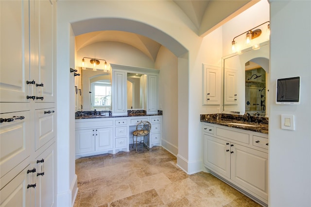 3702 Blue Bonnet, Houston, TX 77025 - bathroom with a shower stall, two vanities, and baseboards