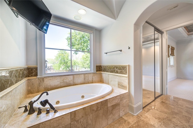 3702 Blue Bonnet, Houston, TX 77025 - bathroom with plenty of natural light, a jetted tub, and crown molding