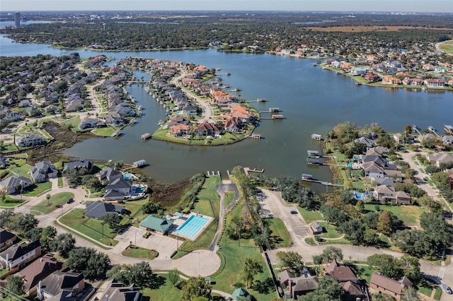 bird's eye view with a residential view and a water view