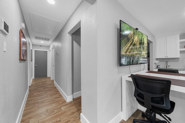 29519 W Hawthorne Dr, Spring, TX 77386 - corridor featuring attic access, light wood-type flooring, baseboards, and an office area
