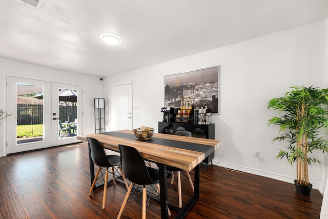 dining area featuring french doors, baseboards, and wood finished floors