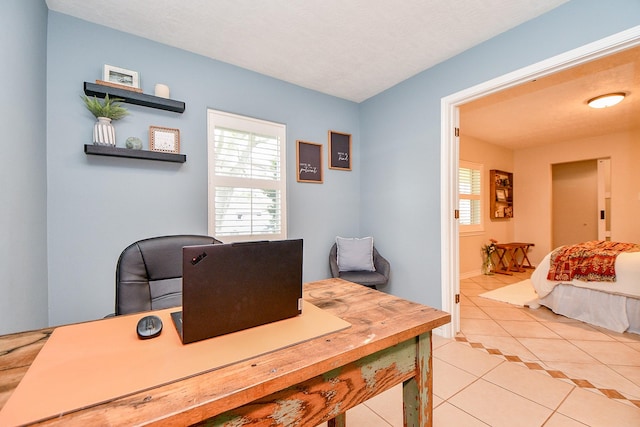 5521 Rosewood Dr, Galveston, TX 77551 - office featuring light tile patterned flooring and a textured ceiling