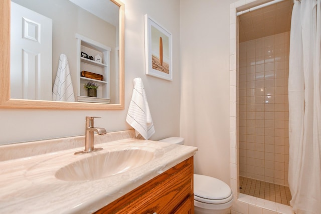 5521 Rosewood Dr, Galveston, TX 77551 - full bathroom featuring toilet, a stall shower, and vanity