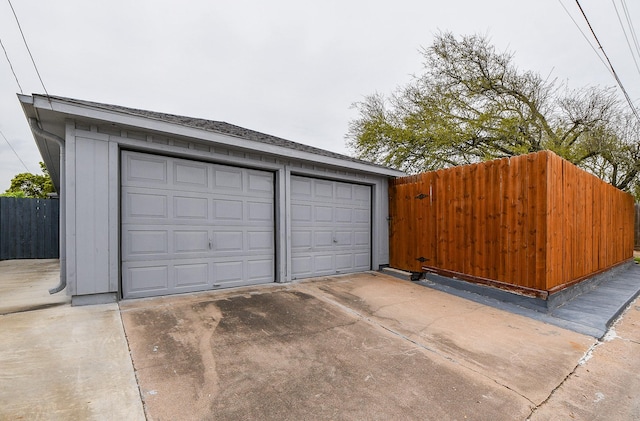 5521 Rosewood Dr, Galveston, TX 77551 - garage featuring fence
