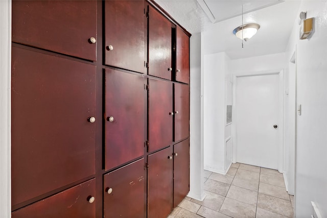 1520 Hillside Dr, College Station, TX 77845 - corridor featuring attic access, visible vents, and light tile patterned floors