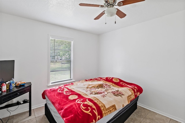 1520 Hillside Dr, College Station, TX 77845 - bedroom featuring ceiling fan, baseboards, and light tile patterned floors