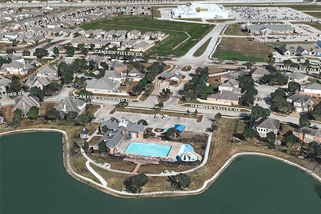 view of property location featuring nearby suburban area and a nearby body of water
