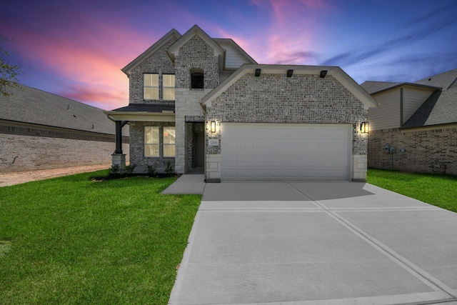 12018 Maple Oak Dr, Houston, TX 77066 - view of front facade with concrete driveway, a garage, a front yard, stone siding, and brick siding