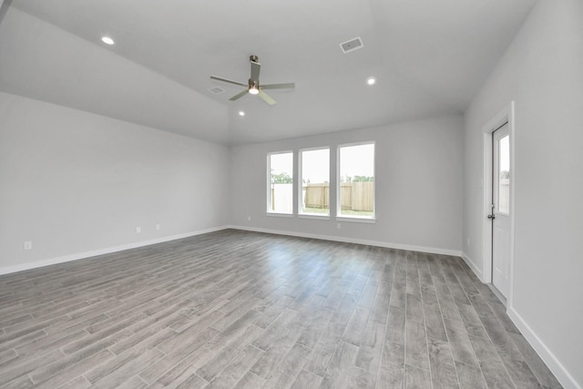 12018 Maple Oak Dr, Houston, TX 77066 - empty room featuring lofted ceiling, wood finished floors, ceiling fan, and recessed lighting