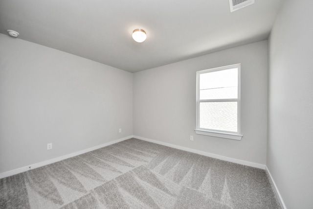 12018 Maple Oak Dr, Houston, TX 77066 - carpeted spare room featuring baseboards and a smoke detector