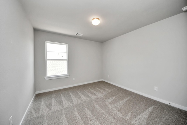 12018 Maple Oak Dr, Houston, TX 77066 - spare room featuring carpet and a smoke detector