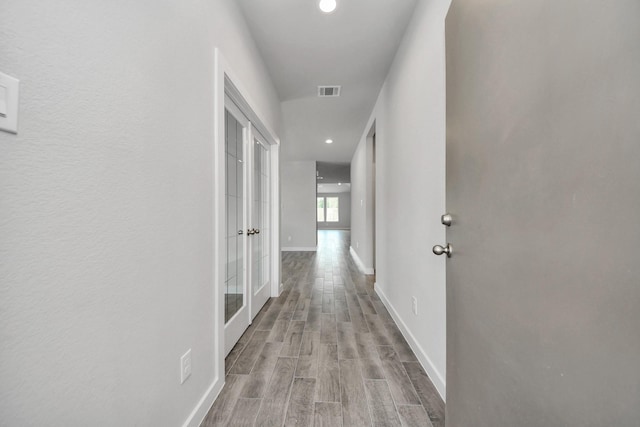 12018 Maple Oak Dr, Houston, TX 77066 - corridor featuring wood finished floors, french doors, and recessed lighting