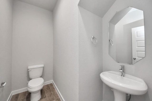 12018 Maple Oak Dr, Houston, TX 77066 - bathroom featuring wood finished floors and toilet