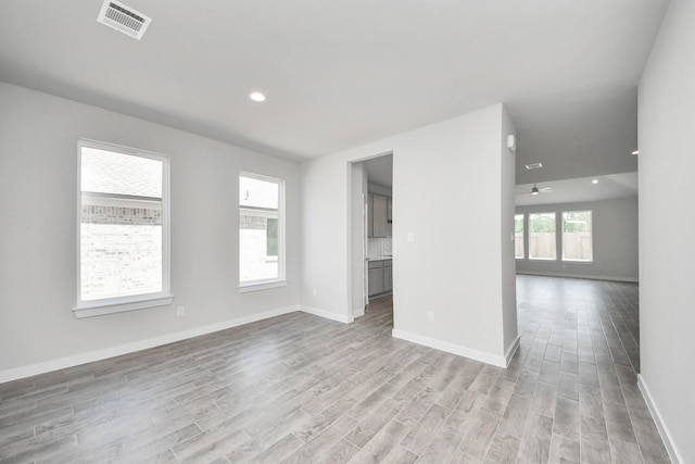 12018 Maple Oak Dr, Houston, TX 77066 - unfurnished room featuring light wood finished floors, a ceiling fan, and recessed lighting