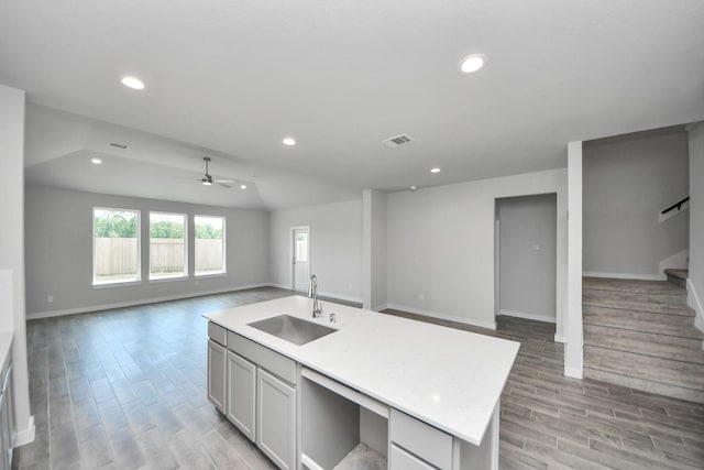 12018 Maple Oak Dr, Houston, TX 77066 - kitchen with open floor plan, recessed lighting, light wood-style floors, light countertops, and a ceiling fan