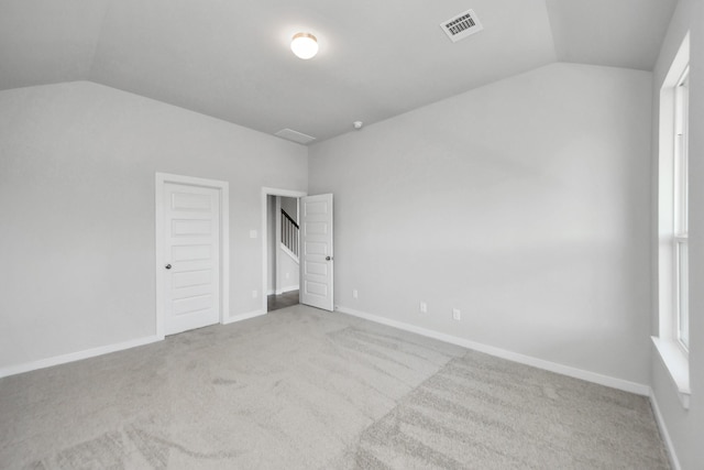 12018 Maple Oak Dr, Houston, TX 77066 - unfurnished bedroom with lofted ceiling and carpet floors