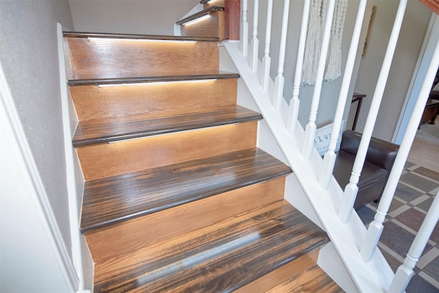 staircase featuring wood finished floors