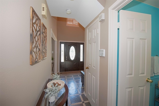 entryway featuring vaulted ceiling