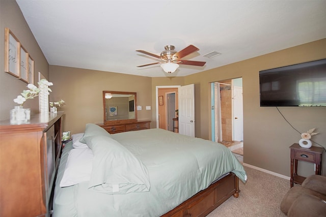 bedroom with light colored carpet, baseboards, and a ceiling fan