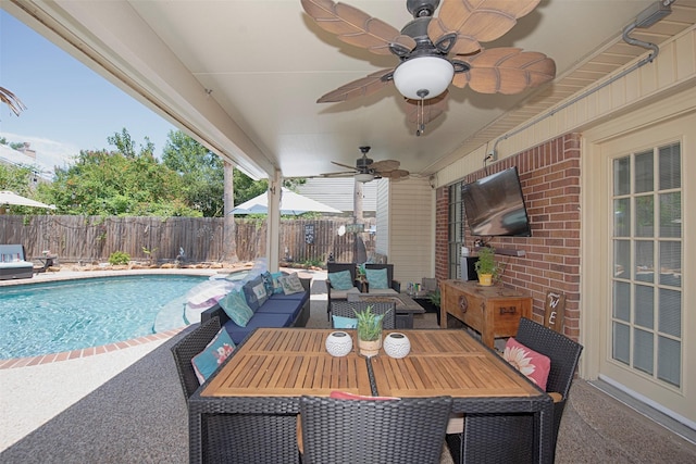 view of patio with a fenced backyard, an outdoor living space, and ceiling fan
