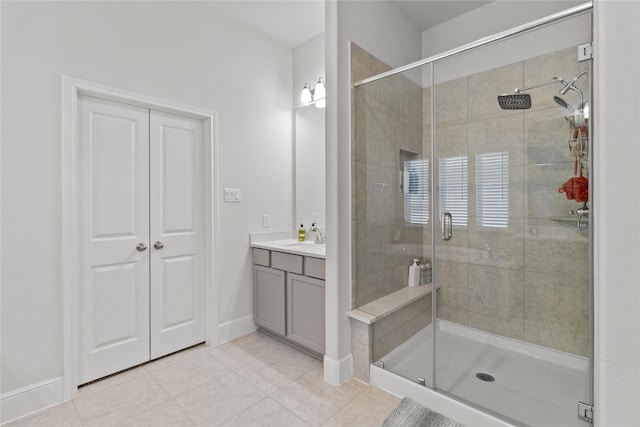 4831 Dove Cove Ln, League City, TX 77573 - full bathroom featuring tile patterned flooring, vanity, a stall shower, and baseboards