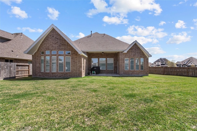 4831 Dove Cove Ln, League City, TX 77573 - back of property with a fenced backyard, a patio, brick siding, and a yard
