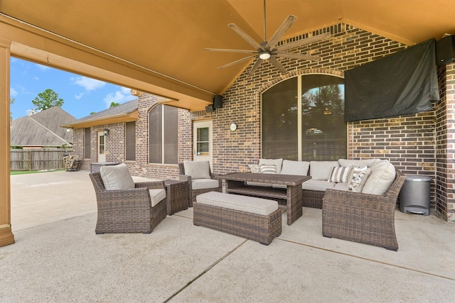 view of patio / terrace with fence, an outdoor hangout area, and ceiling fan