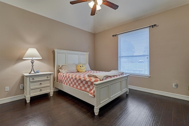 bedroom with baseboards, vaulted ceiling, ceiling fan, and dark wood-style flooring