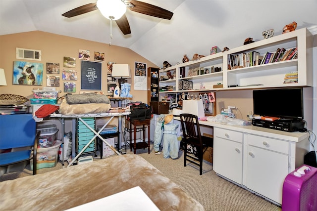 home office with vaulted ceiling, visible vents, a ceiling fan, and light colored carpet
